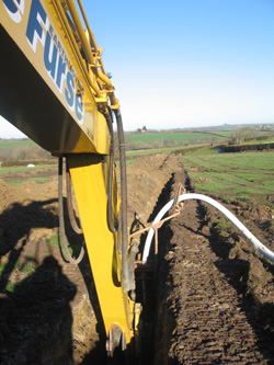 Trench digging and pipe laying